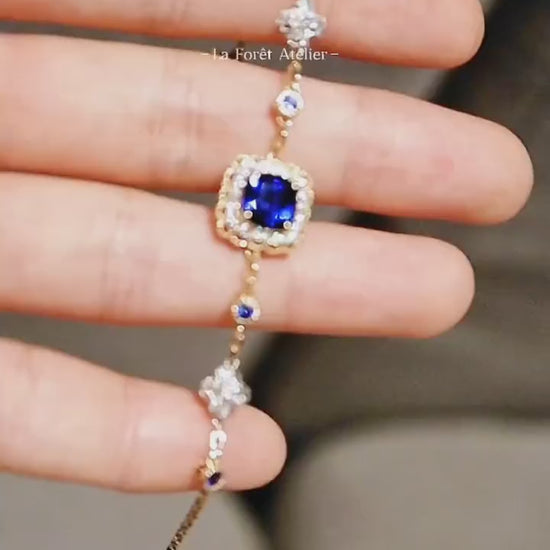 Soraya gold bracelet featuring 2ct lab royal blue sapphire with diamond halo and gemstone accents








