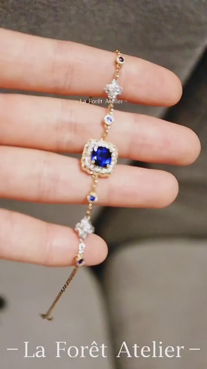 Soraya gold bracelet featuring 2ct lab royal blue sapphire with diamond halo and gemstone accents








