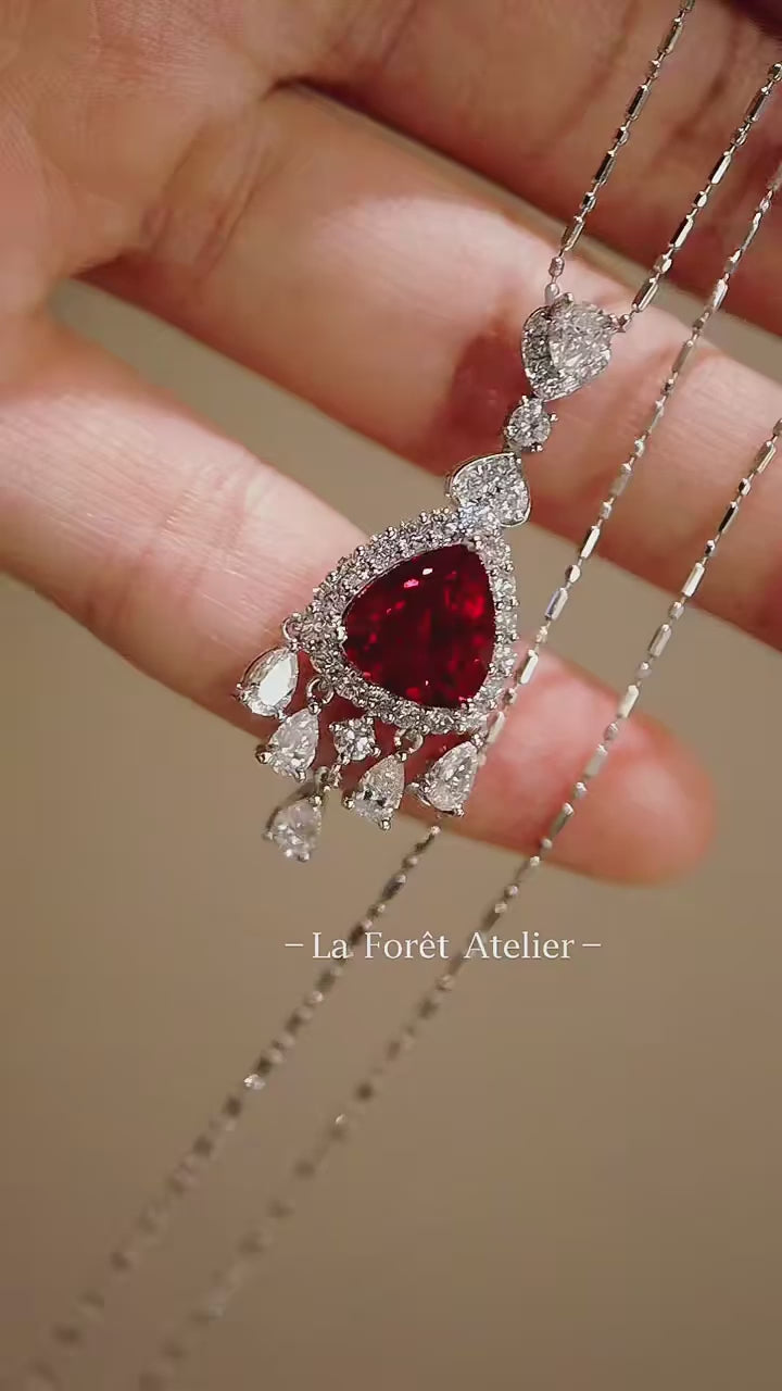 Velmira necklace with 2ct lab-grown pigeon blood ruby, diamond halo, and drop pendant design in white gold – luxury ruby fine jewelry

