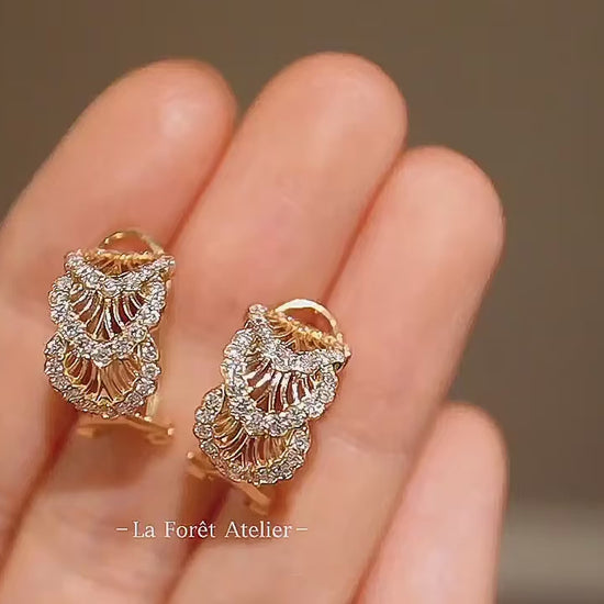 Vintage-style gold hoops with layered diamond detail

