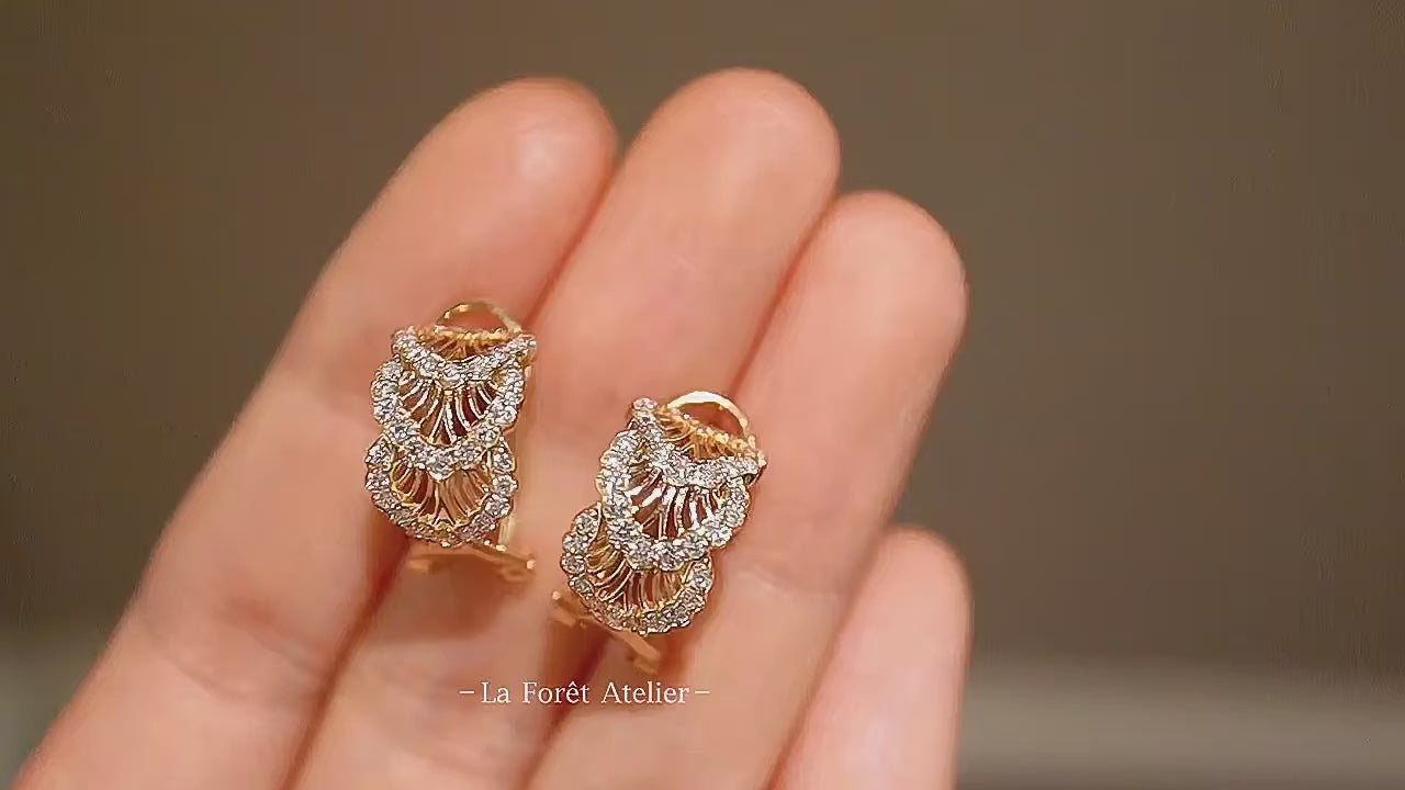 Vintage-style gold hoops with layered diamond detail

