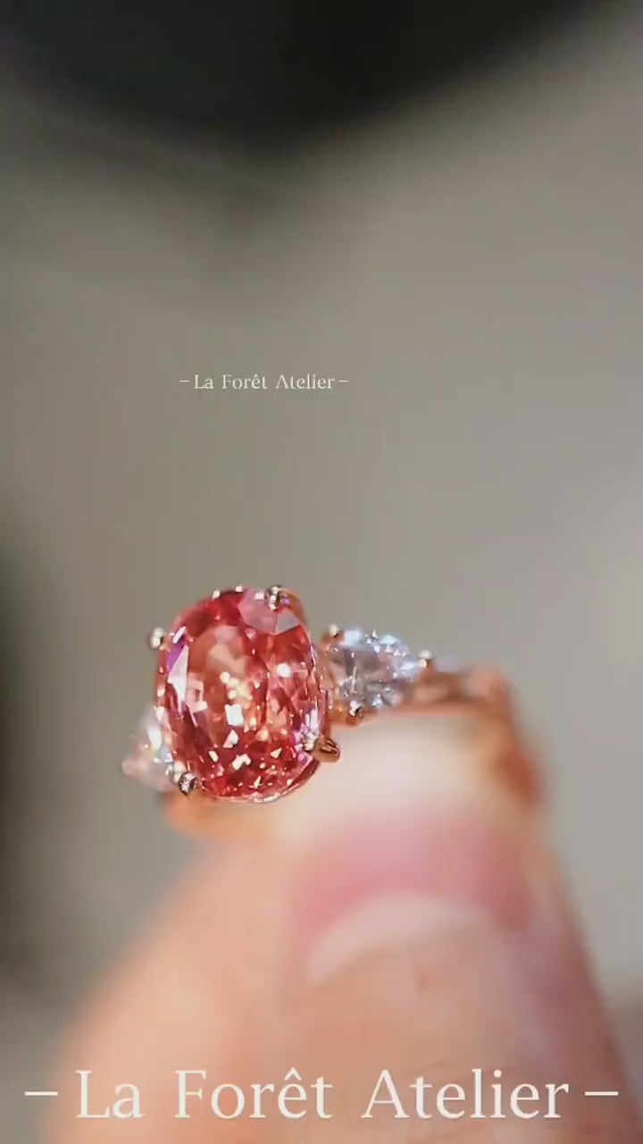 Annelise rose gold ring with 2.5ct lab padparadscha sapphire and pear lab diamond side stones









