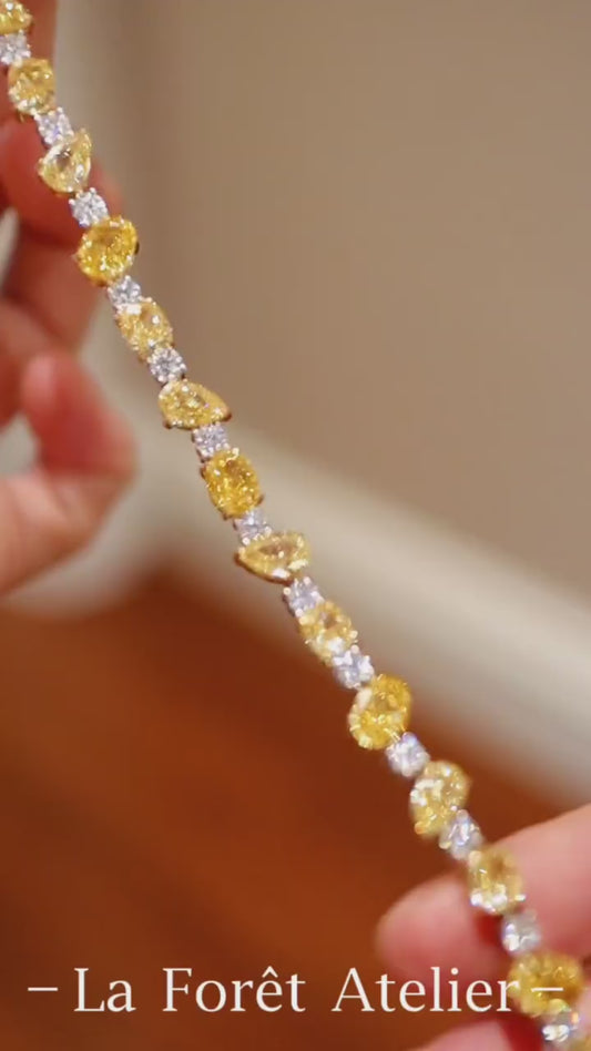 Charisse bracelet with lab-grown yellow diamonds and white diamond accents in pear and oval shapes








