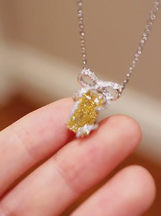 Radiant-cut 3.5ct yellow lab-grown diamond necklace with diamond bow setting









