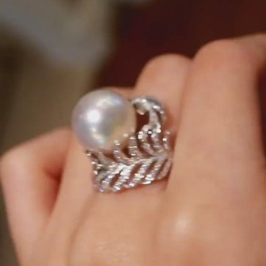 Natural pearl ring with 12–13mm white pearl and diamond wave leaf setting








