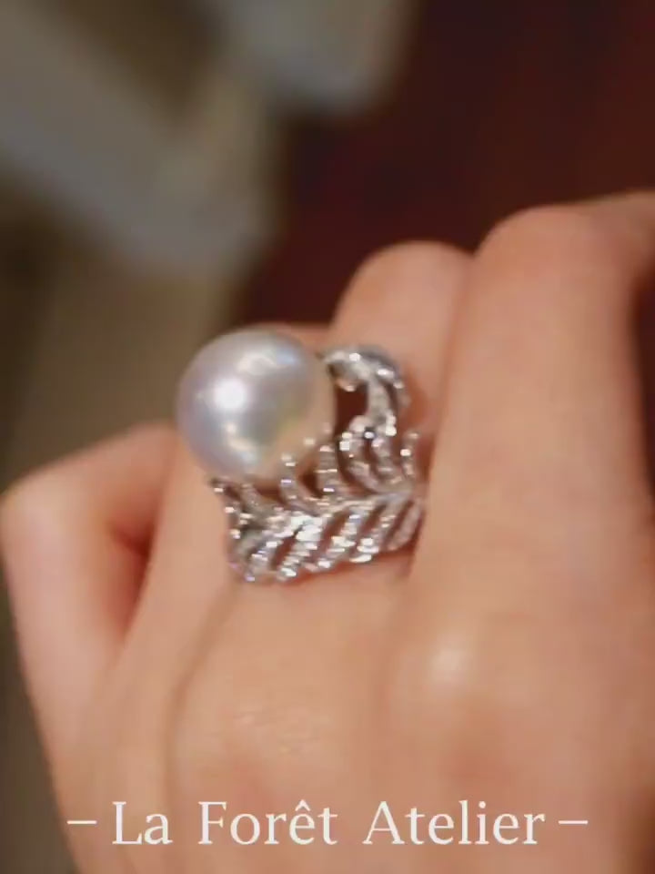 Natural pearl ring with 12–13mm white pearl and diamond wave leaf setting








