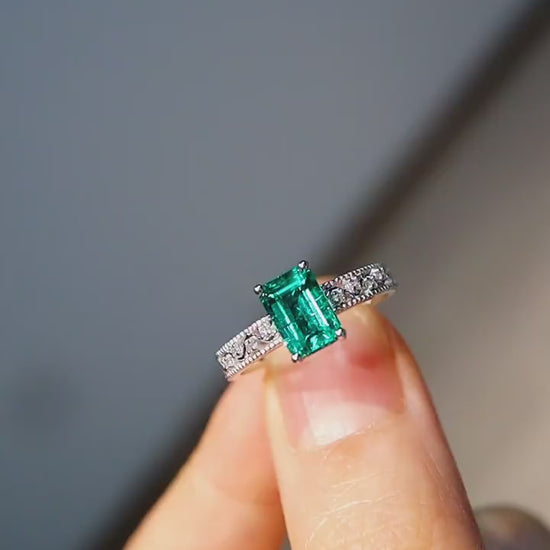 1ct emerald-cut lab emerald ring with diamond band in white gold setting








