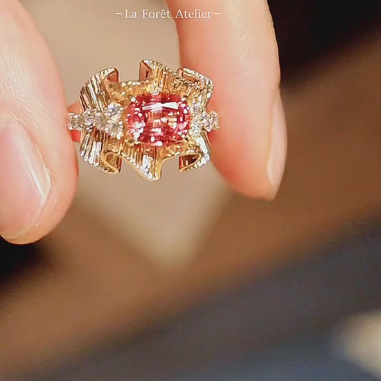 Lab sapphire ring with flowing gold design and diamond accents

