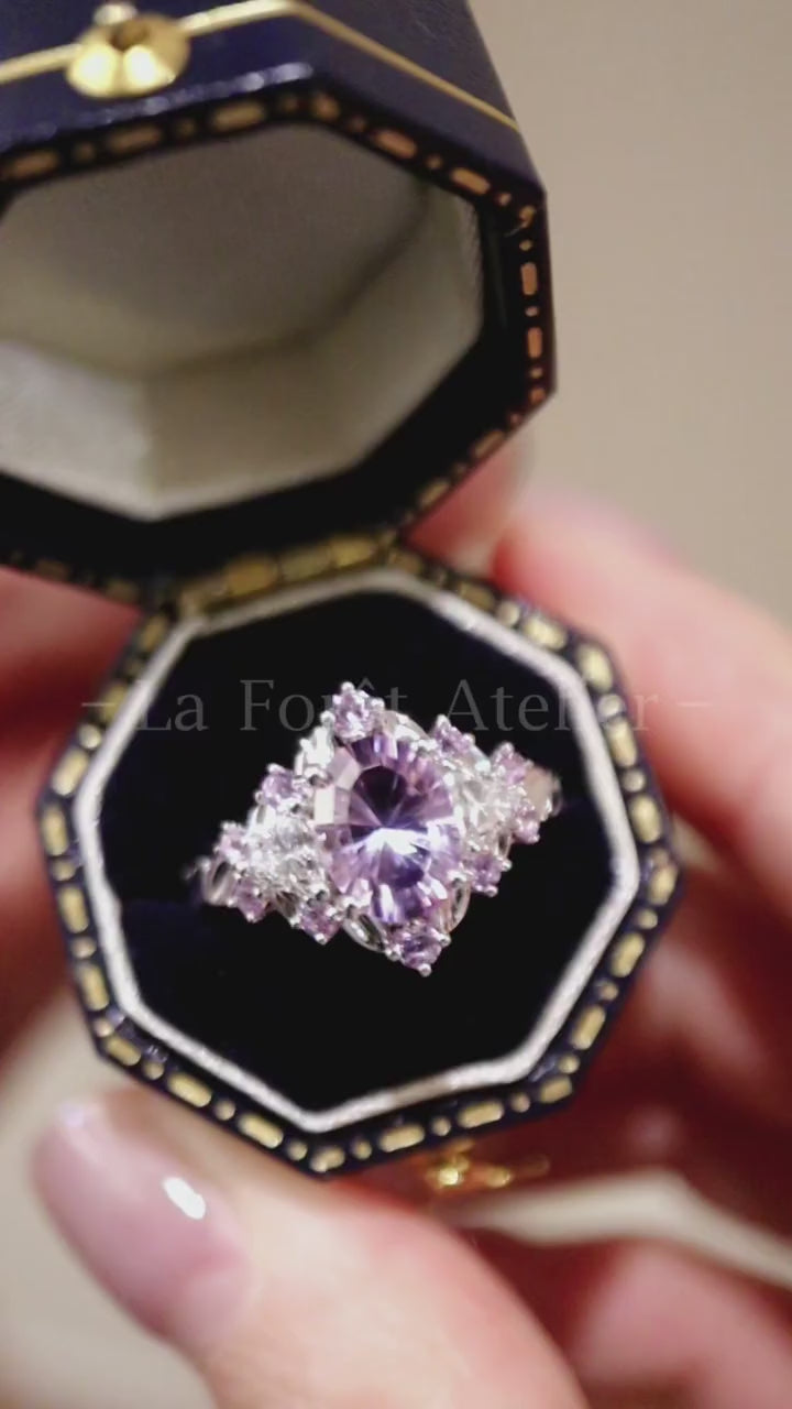 Jaevia ring featuring 1ct lavender lab sapphire with pink sapphires and diamond halo









