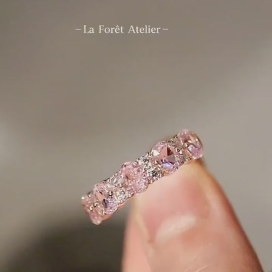 Aureline rose gold ring with alternating lab pink and white diamonds in an eternity style








