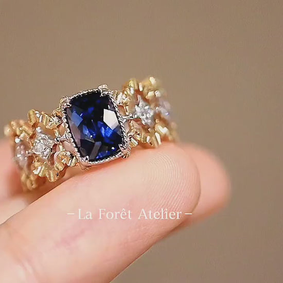 Deep blue lab sapphire ring with diamonds in antique gold

