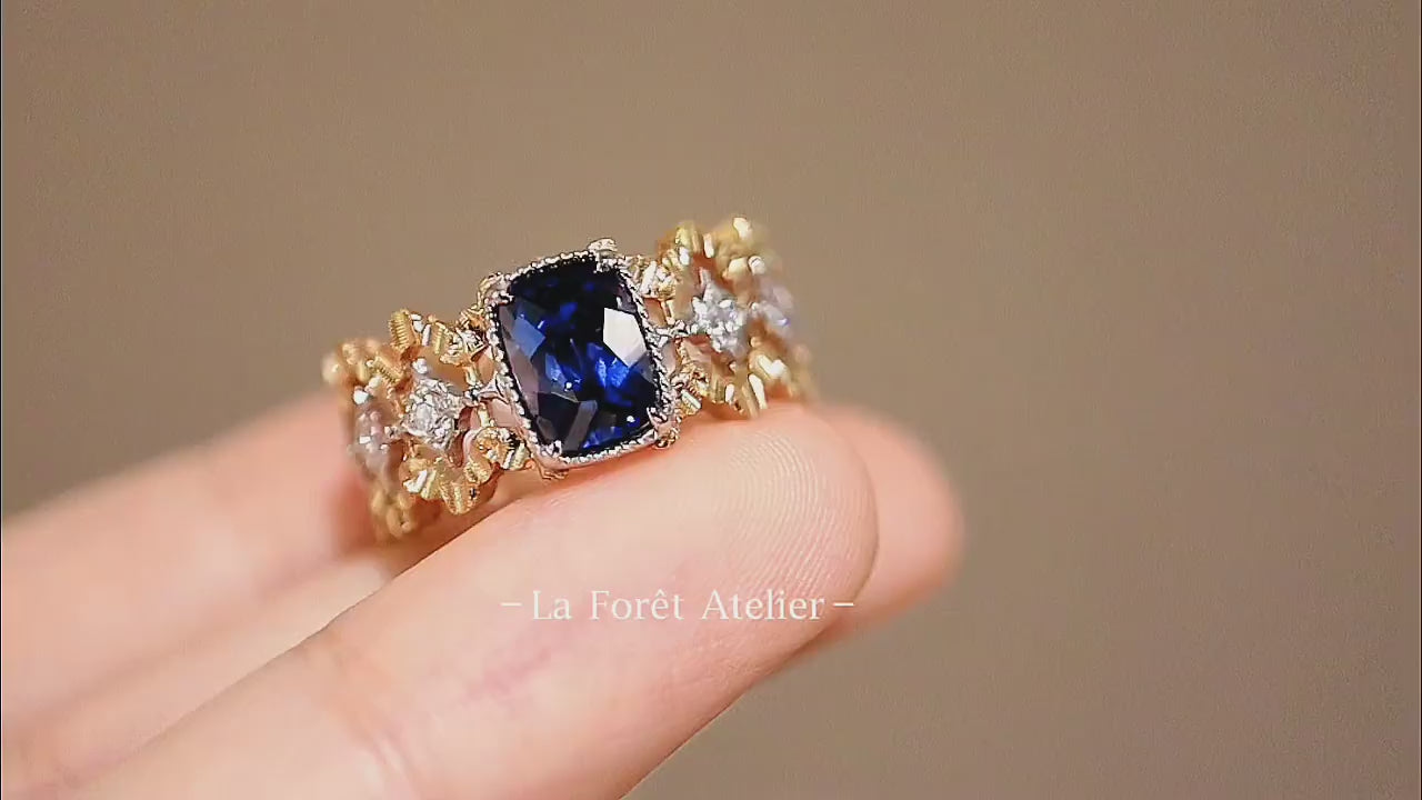 Deep blue lab sapphire ring with diamonds in antique gold

