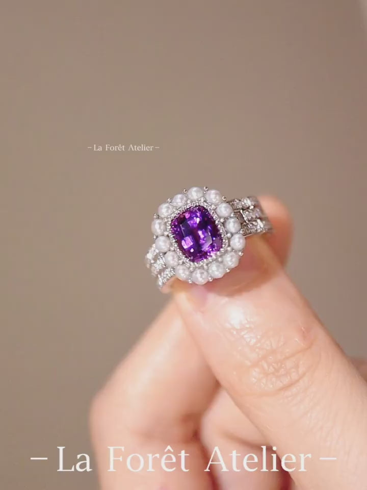 White gold ring with lab lavender sapphire, freshwater pearl halo, and lab diamond accents








