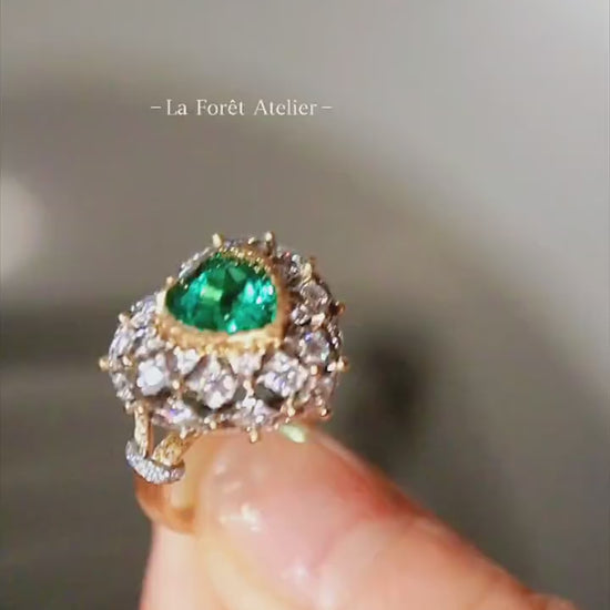 Vintage-inspired emerald and diamond cocktail ring

