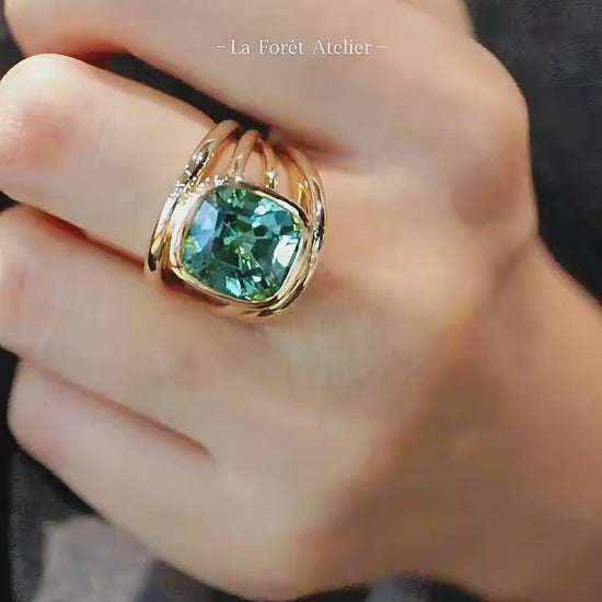Wide band lab tourmaline ring in square bezel setting

