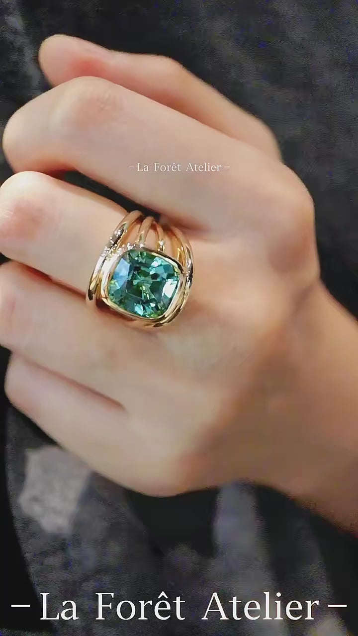 Wide band lab tourmaline ring in square bezel setting

