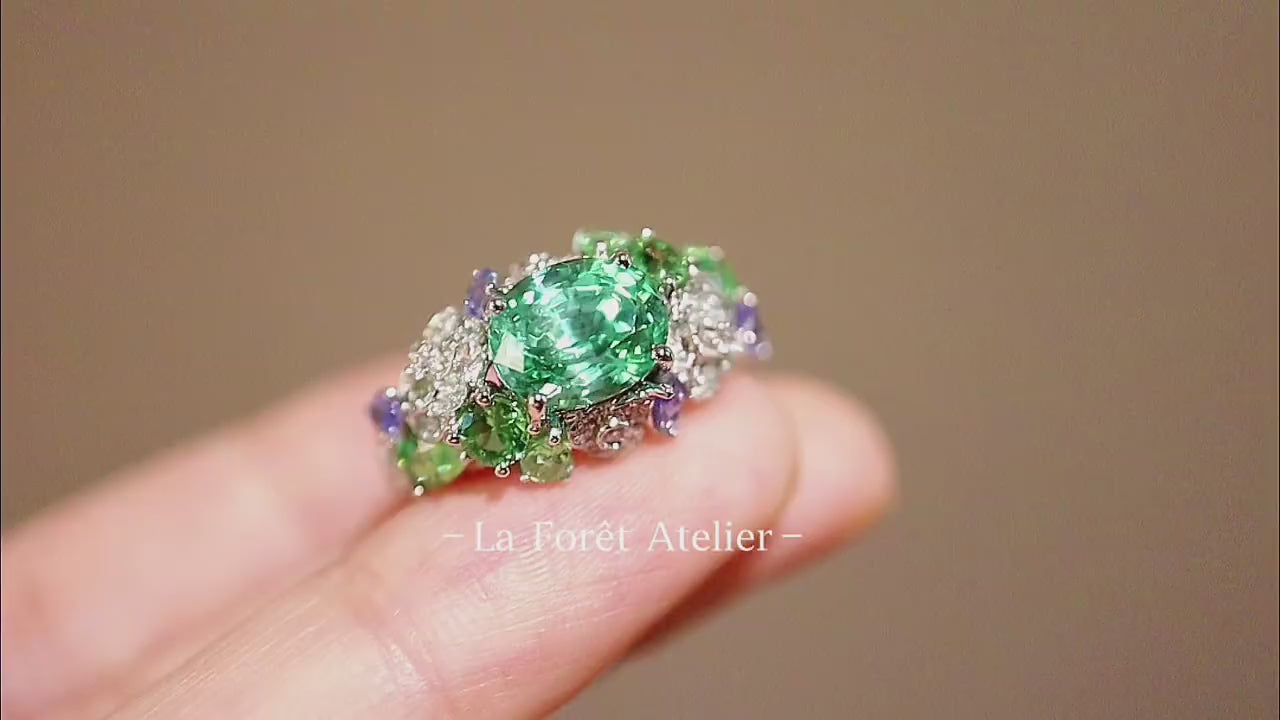 3ct lab grown tsavorite ring with diamond and tanzanite accents