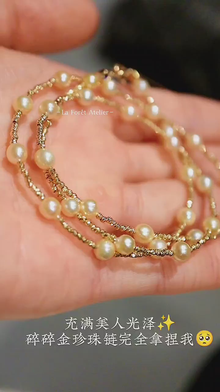 Éclat necklace featuring ivory pearls and faceted gold beads

