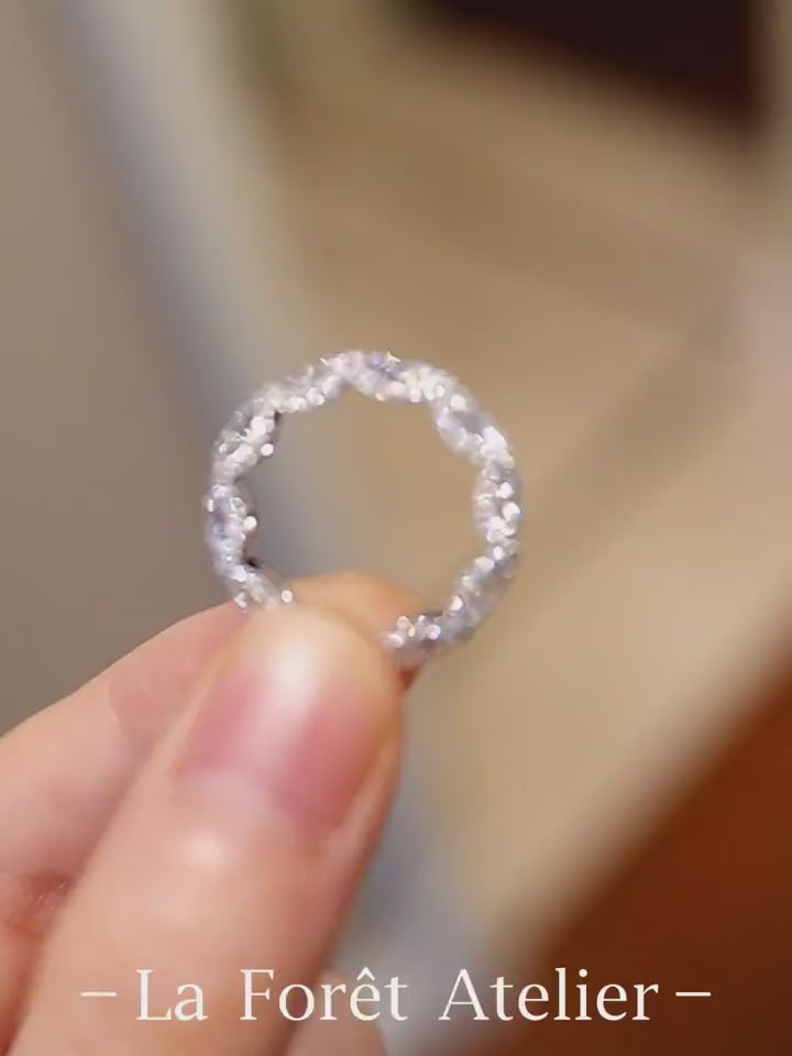 Oval lab-grown diamond eternity band with scalloped setting design








