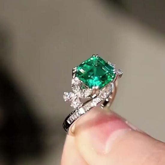 Vintage swirl ring with lab-grown emerald and floral diamond accents








