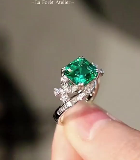 Vintage swirl ring with lab-grown emerald and floral diamond accents








