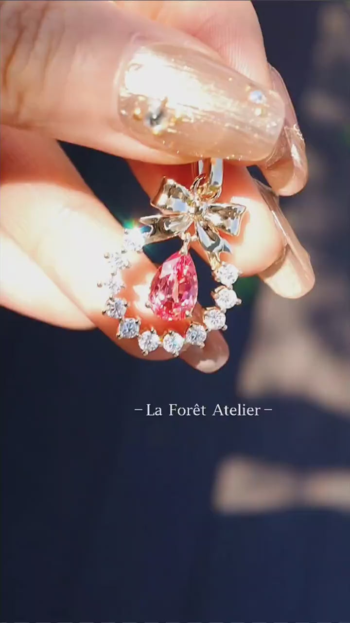 Wreath pendant featuring pear-cut Padparadscha and diamonds

