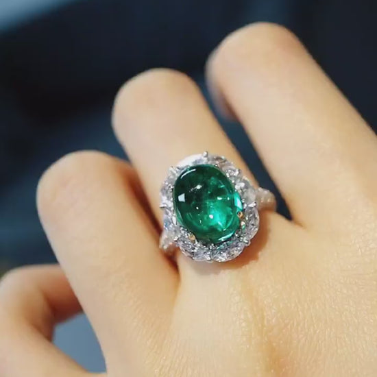 Vaelle ring featuring 5ct lab grown emerald and marquise diamond halo in white gold









