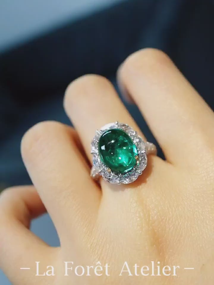 Vaelle ring featuring 5ct lab grown emerald and marquise diamond halo in white gold








