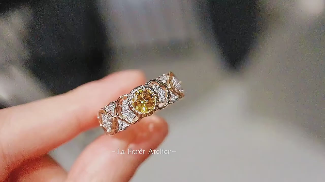 Vintage-style fancy yellow diamond ring with white lab accents

