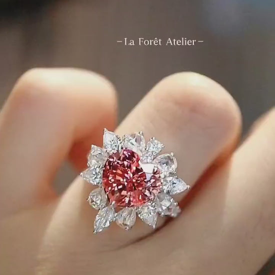 Romantic heart-shaped lab padparadscha sapphire ring with diamond halo








