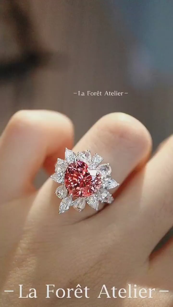 Romantic heart-shaped lab padparadscha sapphire ring with diamond halo








