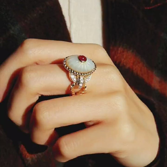 Statement ring with lab-grown ruby and carved mother-of-pearl dome with gold and diamond accents








