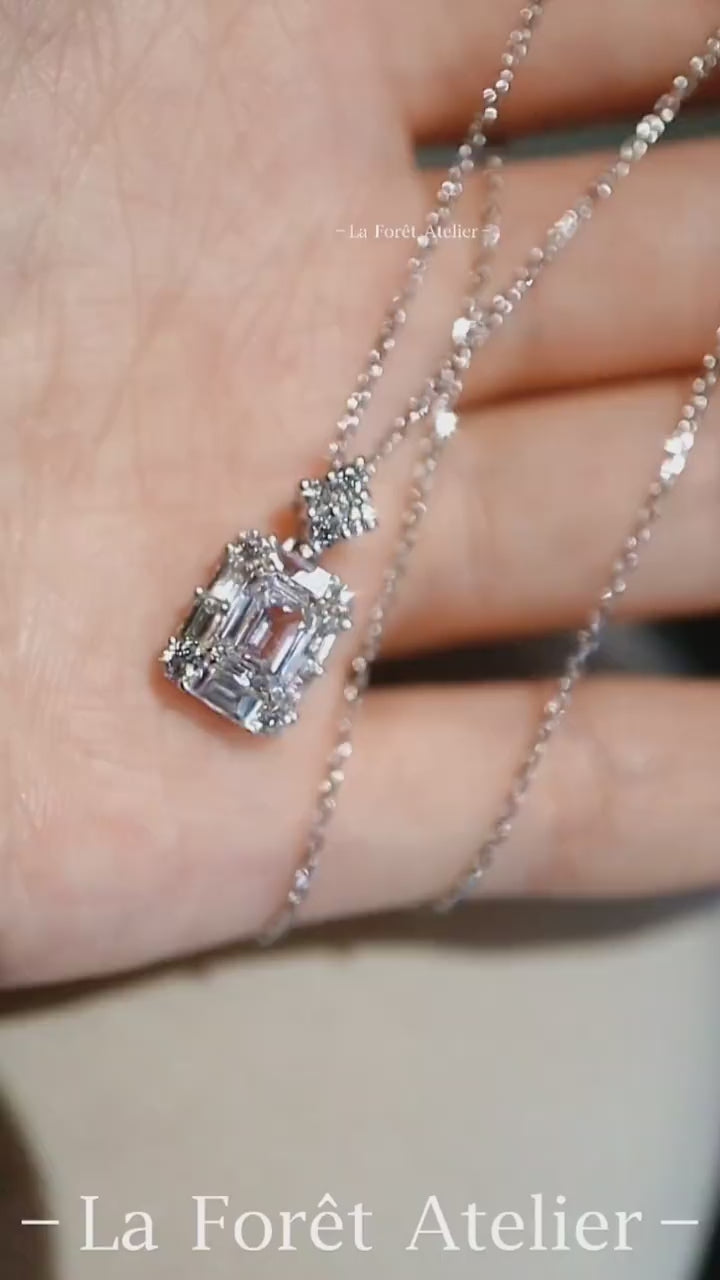 Close-up of emerald-cut diamond pendant with lab accents