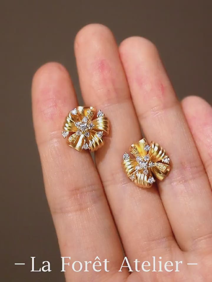 Vintage floral earrings with twisted gold ribbons and lab-grown diamond centers

