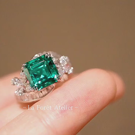 Lab emerald statement ring with white gold floral design

