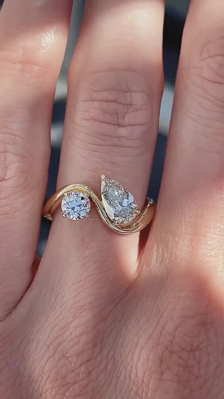Yellow gold lab diamond ring featuring round and pear shapes