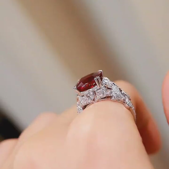 Vintage-style lab-grown ruby ring with cushion-cut center and pavé diamonds in white gold









