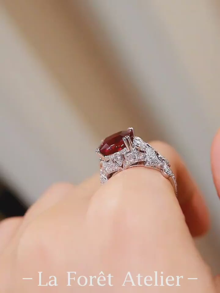 Vintage-style lab-grown ruby ring with cushion-cut center and pavé diamonds in white gold








