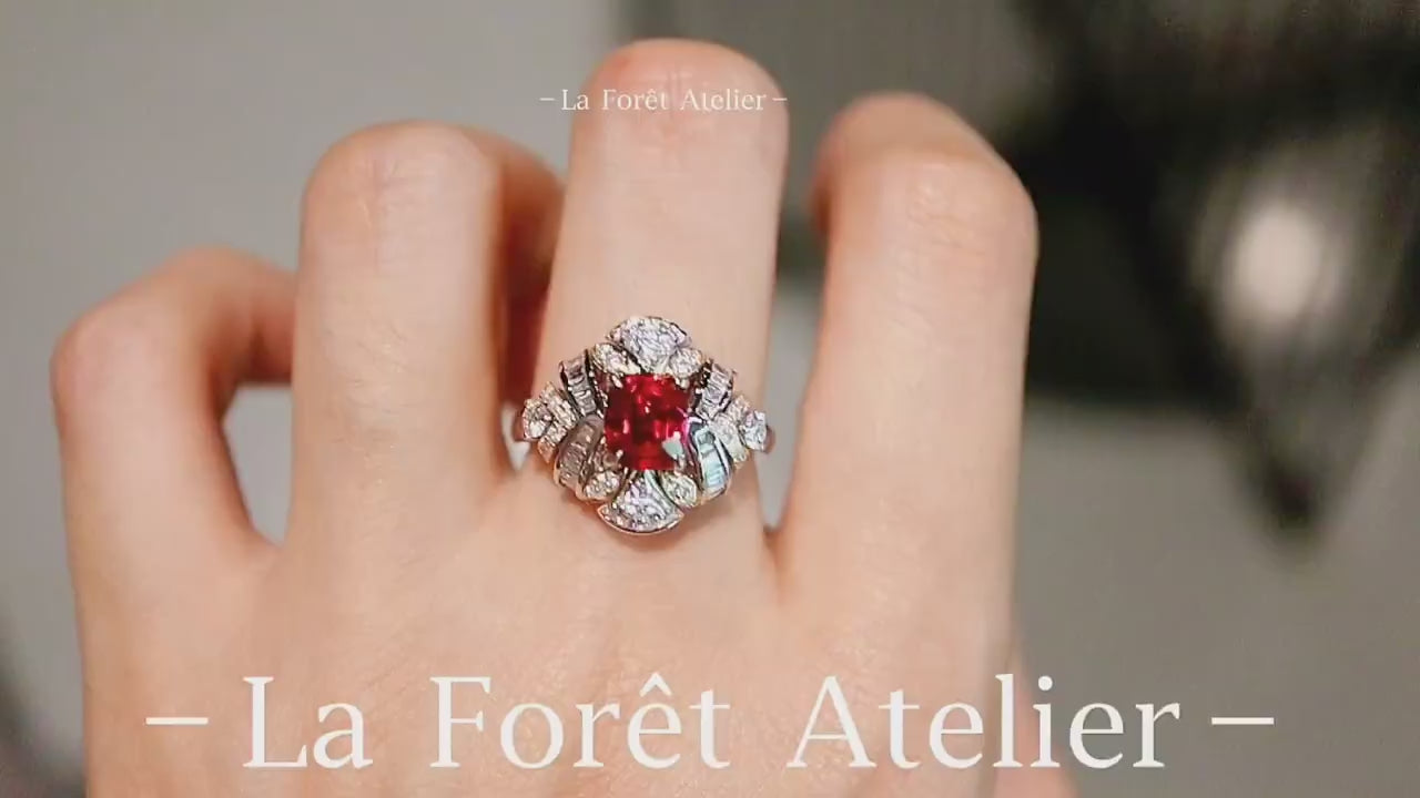 Vintage-inspired ruby and diamond statement ring with cushion center stone








