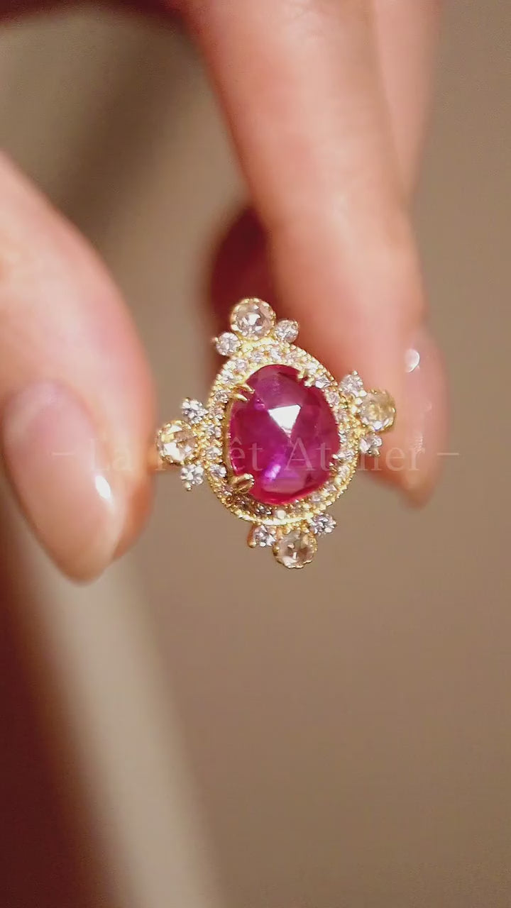 Xantheia 3ct pear lab ruby ring with 4 rose-cut diamonds in gold halo setting